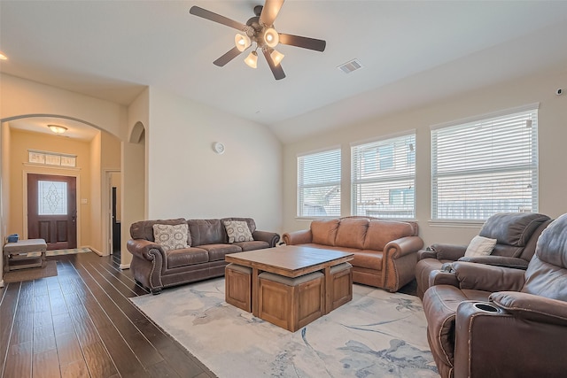 16742 Highland Country Dr, Cypress, TX 77433 - living area featuring arched walkways, vaulted ceiling, a ceiling fan, light wood-style floors, and baseboards
