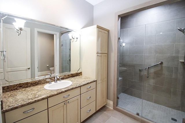 2207 Postoffice St Unit 208, Galveston, TX 77550 - full bathroom with toilet, a stall shower, vanity, and tile patterned floors