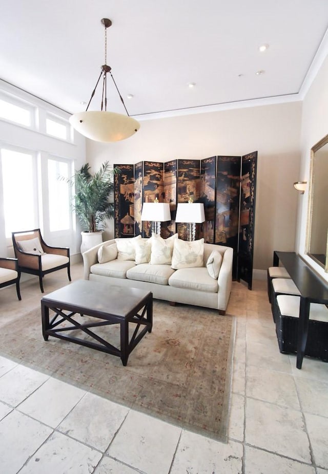 2207 Postoffice St Unit 208, Galveston, TX 77550 - living area featuring crown molding and baseboards