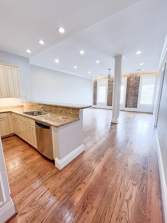2207 Postoffice St Unit 208, Galveston, TX 77550 - kitchen featuring stainless steel dishwasher, ornate columns, open floor plan, plenty of natural light, and recessed lighting