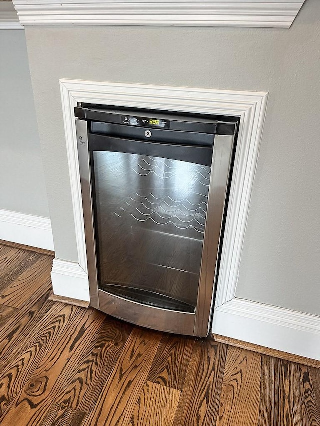 2207 Postoffice St Unit 208, Galveston, TX 77550 - detailed view of baseboards and wine cooler