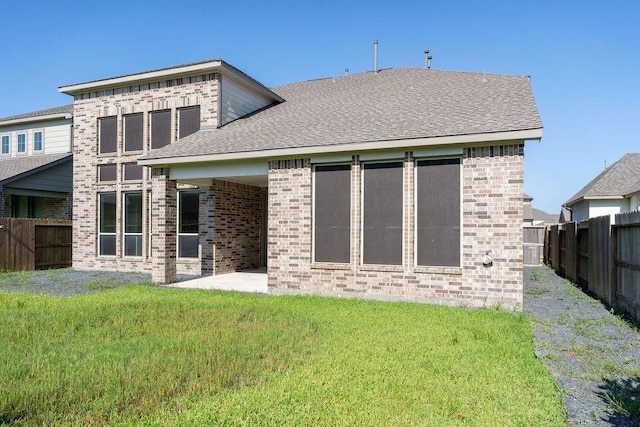 15842 Formaston Forest Dr, Humble, TX 77346 - rear view of house featuring brick siding, a patio area, and roof with shingles