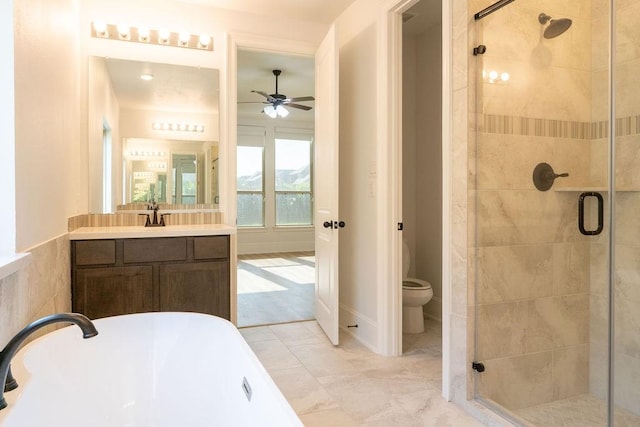 15842 Formaston Forest Dr, Humble, TX 77346 - full bathroom featuring ceiling fan, a freestanding bath, a stall shower, toilet, and vanity