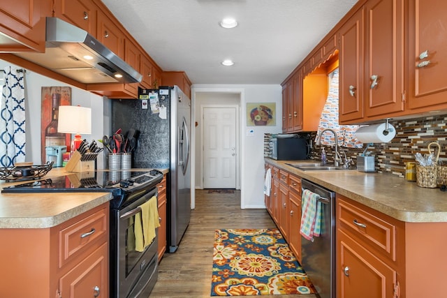 246 Indian Falls Ln, Livingston, TX 77351 - kitchen featuring range with electric cooktop, stainless steel dishwasher, extractor fan, a sink, and backsplash