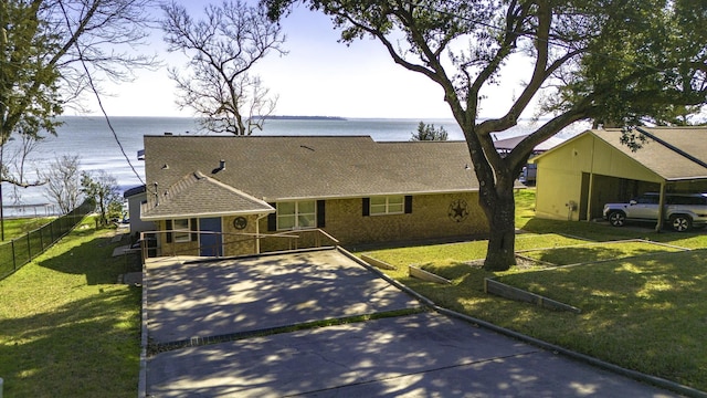 246 Indian Falls Ln, Livingston, TX 77351 - view of front of house featuring a water view and a shingled roof