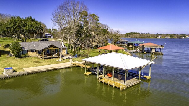 246 Indian Falls Ln, Livingston, TX 77351 - dock featuring boat lift and a water view