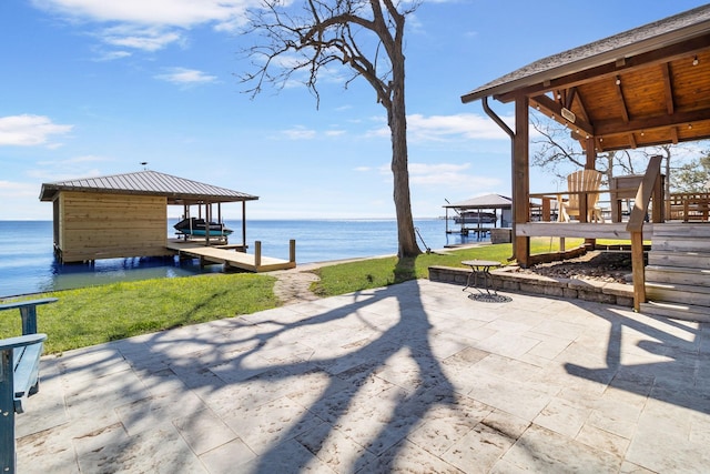 246 Indian Falls Ln, Livingston, TX 77351 - view of patio / terrace featuring boat lift, a water view, and a boat dock