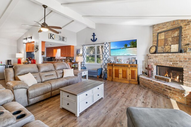 246 Indian Falls Ln, Livingston, TX 77351 - living room featuring ceiling fan, light wood-type flooring, and a fireplace
