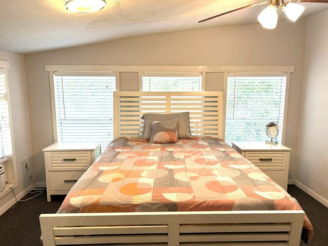320 Deer Run Rd, Trinity, TX 75862 - bedroom with dark carpet, baseboards, vaulted ceiling, and ceiling fan