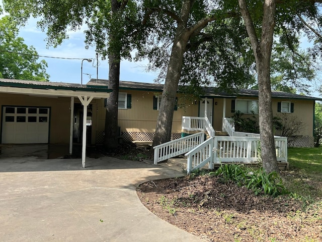 320 Deer Run Rd, Trinity, TX 75862 - single story home with driveway and a garage