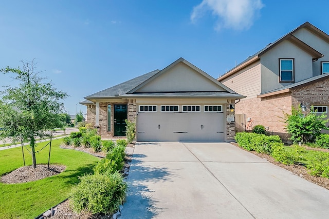 1603 N City Oaks Ln, Houston, TX 77047 - view of front of house featuring driveway, a front lawn, a garage, and brick siding