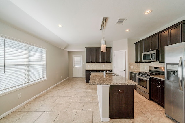 1603 N City Oaks Ln, Houston, TX 77047 - kitchen featuring stainless steel appliances, a sink, decorative backsplash, light tile patterned flooring, and recessed lighting