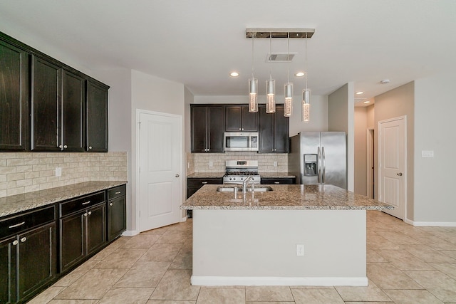 1603 N City Oaks Ln, Houston, TX 77047 - kitchen featuring stainless steel appliances, light stone countertops, a sink, backsplash, and light tile patterned flooring
