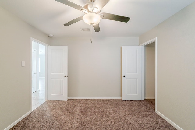 1603 N City Oaks Ln, Houston, TX 77047 - carpeted spare room with a ceiling fan, baseboards, and a smoke detector