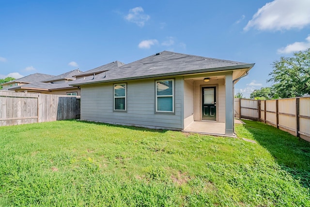 1603 N City Oaks Ln, Houston, TX 77047 - rear view of property with a shingled roof and a patio