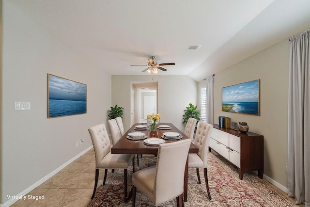 1603 N City Oaks Ln, Houston, TX 77047 - dining area featuring baseboards, ceiling fan, vaulted ceiling, and light tile patterned flooring
