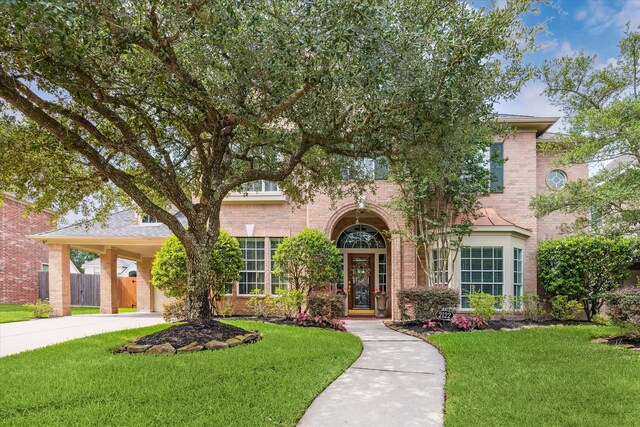 2122 Misty River Trl, Kingwood, TX 77345 - view of front of house with brick siding and driveway