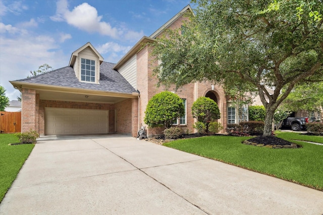 2122 Misty River Trl, Kingwood, TX 77345 - view of front of home with concrete driveway, roof with shingles, brick siding, and an attached garage