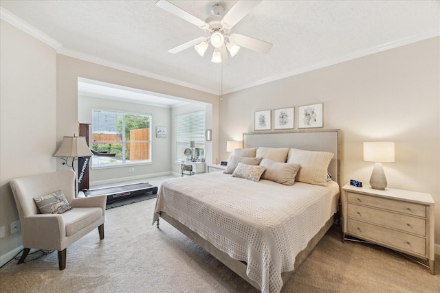 2122 Misty River Trl, Kingwood, TX 77345 - bedroom with carpet floors, ornamental molding, ceiling fan, and baseboards