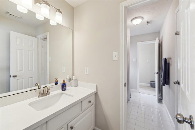 2122 Misty River Trl, Kingwood, TX 77345 - bathroom with tile patterned floors, vanity, and baseboards