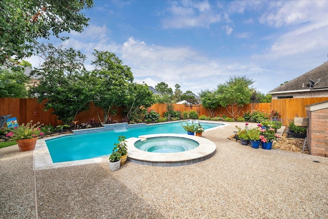 2122 Misty River Trl, Kingwood, TX 77345 - view of pool with a fenced backyard, a pool with connected hot tub, and a patio area