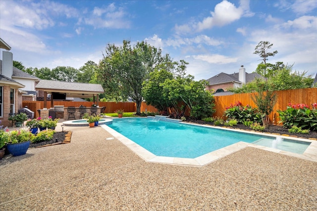 2122 Misty River Trl, Kingwood, TX 77345 - view of pool with a fenced backyard, a patio area, and a pool with connected hot tub