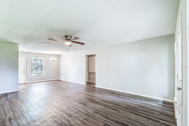 828 Noreda St, Angleton, TX 77515 - unfurnished room featuring a chandelier, a ceiling fan, dark wood-type flooring, a textured ceiling, and baseboards