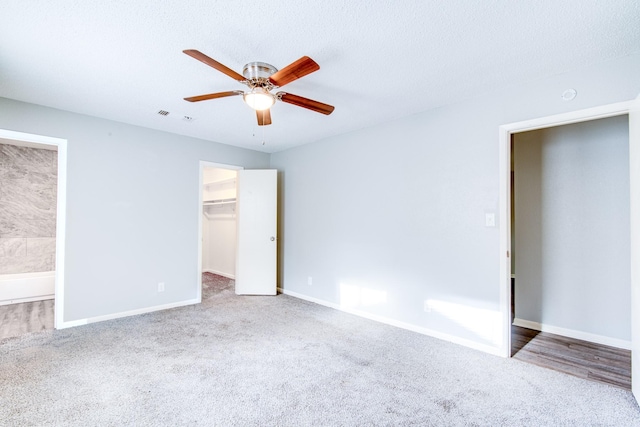 828 Noreda St, Angleton, TX 77515 - unfurnished bedroom featuring carpet floors, baseboards, a spacious closet, ensuite bath, and a closet