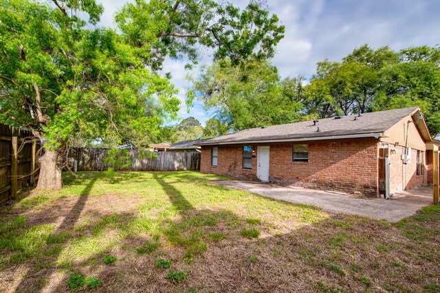 828 Noreda St, Angleton, TX 77515 - rear view of house with brick siding