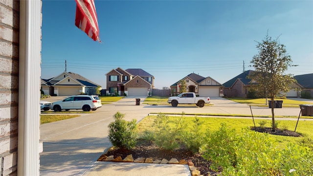 2002 Village Orchard Ln, Katy, TX 77423 - view of grassy yard featuring a residential view and concrete driveway