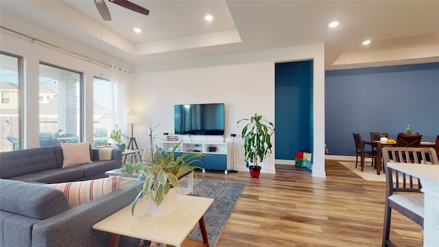 2002 Village Orchard Ln, Katy, TX 77423 - living area with a raised ceiling, ceiling fan, wood finished floors, recessed lighting, and baseboards