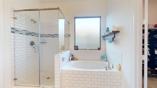 2002 Village Orchard Ln, Katy, TX 77423 - full bathroom with a garden tub, a stall shower, and a spacious closet