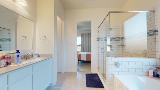 2002 Village Orchard Ln, Katy, TX 77423 - ensuite bathroom with a stall shower, a garden tub, vanity, tile patterned floors, and baseboards
