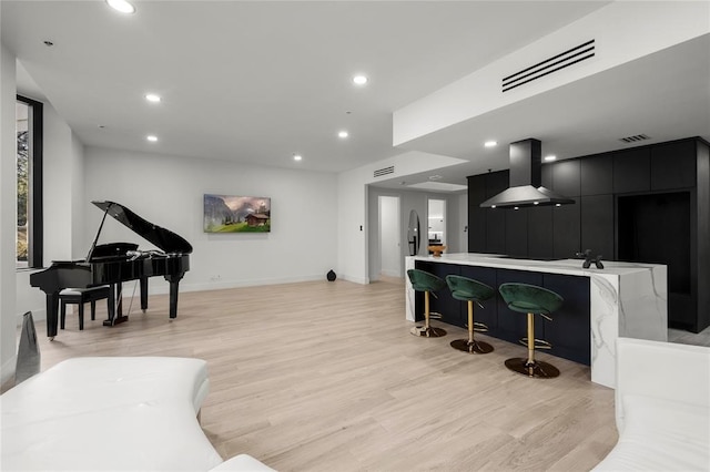 5555 Del Monte Dr Unit 103, Houston, TX 77056 - living area featuring light wood-style floors, recessed lighting, and baseboards