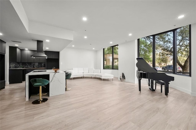 5555 Del Monte Dr Unit 103, Houston, TX 77056 - living room with recessed lighting, light wood finished floors, and baseboards