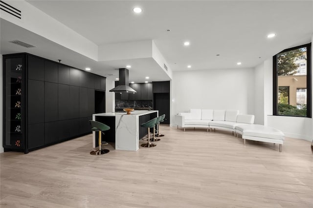 5555 Del Monte Dr Unit 103, Houston, TX 77056 - living area with light wood-style floors, recessed lighting, and baseboards