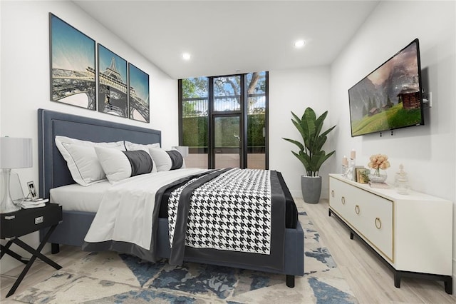 5555 Del Monte Dr Unit 103, Houston, TX 77056 - bedroom featuring light wood-style flooring, floor to ceiling windows, and recessed lighting