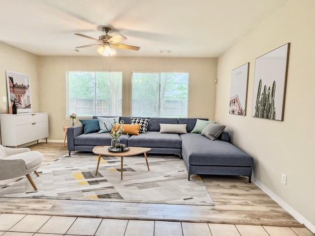 1119 Autumn Green Dr, Missouri City, TX 77459 - living area with healthy amount of natural light, a ceiling fan, and light wood-type flooring