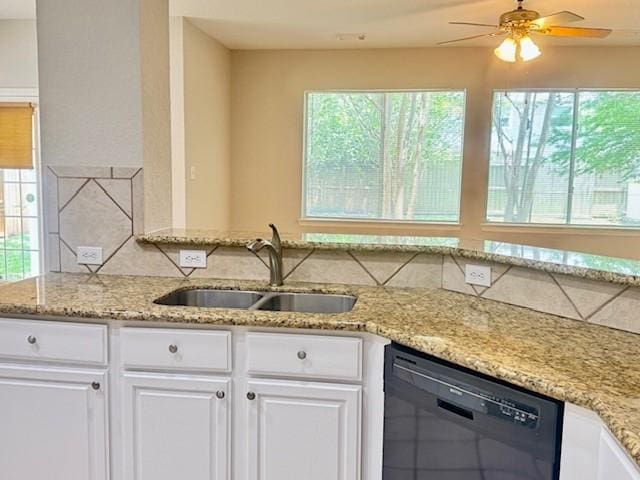 1119 Autumn Green Dr, Missouri City, TX 77459 - kitchen with a sink, black dishwasher, tasteful backsplash, a ceiling fan, and white cabinets