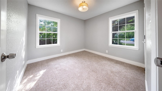 306 W Wilkins St, League City, TX 77573 - carpeted empty room featuring baseboards
