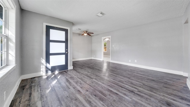 306 W Wilkins St, League City, TX 77573 - unfurnished room featuring wood finished floors, a textured ceiling, a ceiling fan, and baseboards
