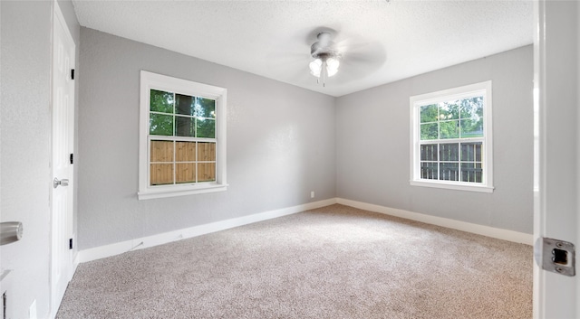 306 W Wilkins St, League City, TX 77573 - carpeted spare room with a ceiling fan, baseboards, and a textured ceiling