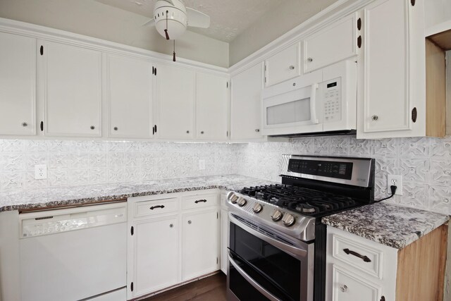 14922 Sandy Creek Dr, Houston, TX 77070 - kitchen featuring white appliances, white cabinets, a ceiling fan, and tasteful backsplash