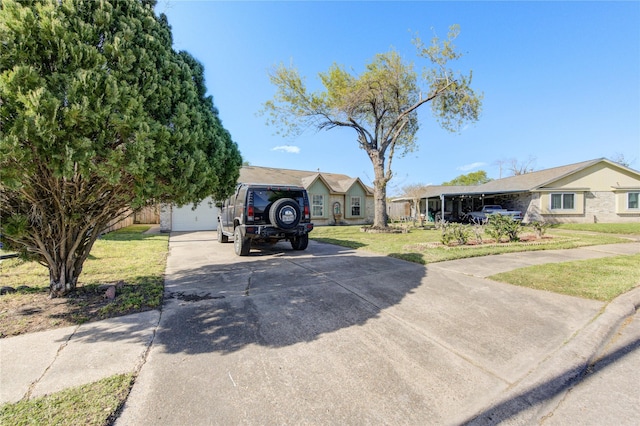 1311 Bournemouth Dr, Pasadena, TX 77504 - view of front of house featuring driveway, a front yard, and a garage