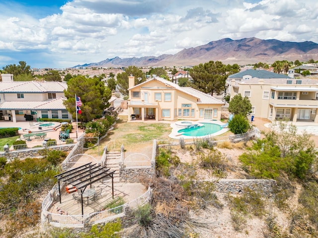 6574 Eagle Ridge Dr, El Paso, TX 79912 - view of swimming pool with a fenced backyard, a pool with connected hot tub, a patio, and a mountain view