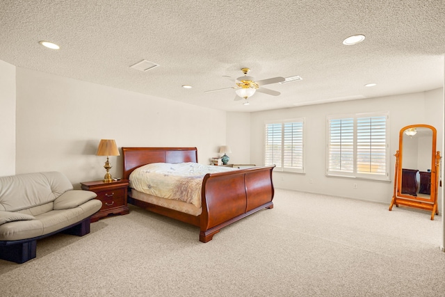 6574 Eagle Ridge Dr, El Paso, TX 79912 - carpeted bedroom with a textured ceiling, recessed lighting, a ceiling fan, and baseboards