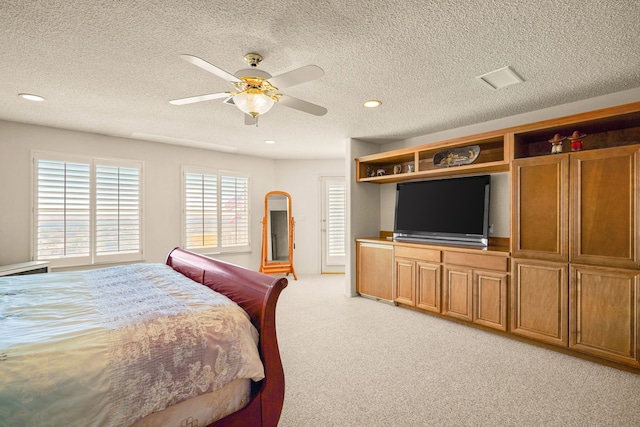 6574 Eagle Ridge Dr, El Paso, TX 79912 - bedroom with light colored carpet, a textured ceiling, recessed lighting, and ceiling fan