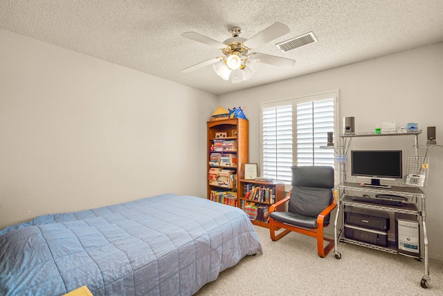 6574 Eagle Ridge Dr, El Paso, TX 79912 - bedroom with carpet, a textured ceiling, and a ceiling fan