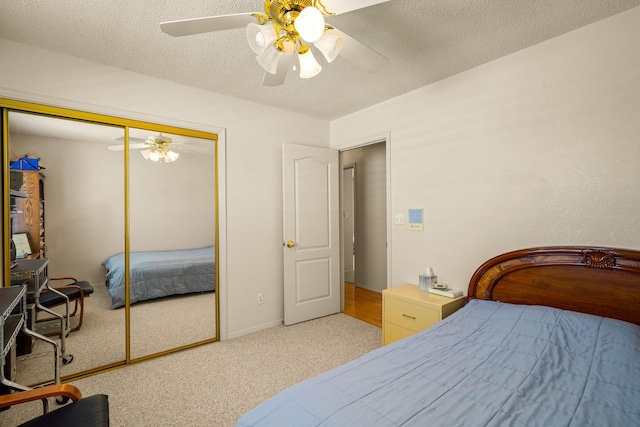 6574 Eagle Ridge Dr, El Paso, TX 79912 - bedroom featuring carpet flooring, a ceiling fan, a textured ceiling, and a closet