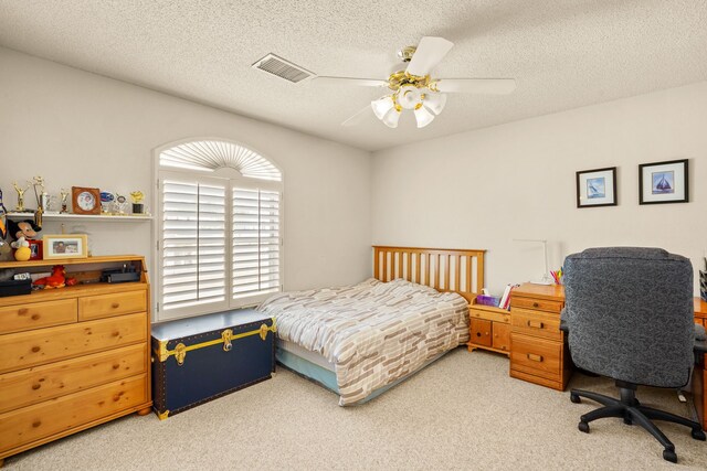 6574 Eagle Ridge Dr, El Paso, TX 79912 - bedroom featuring light colored carpet, ceiling fan, and a textured ceiling
